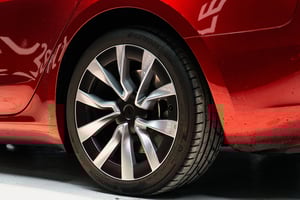Red Tesla Model 3 Highland Rim